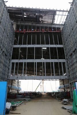 Modular Exhibition Space with Large Column-Free Interior and Insulated Composite Panels for Steel Structure Halls